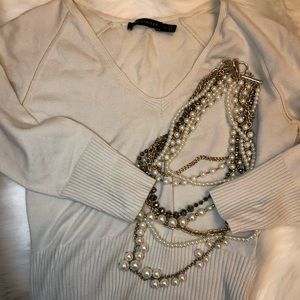 The limited stretchy cream sweater